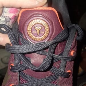 Nike Maroon Basketball Shoe with Orange Accents